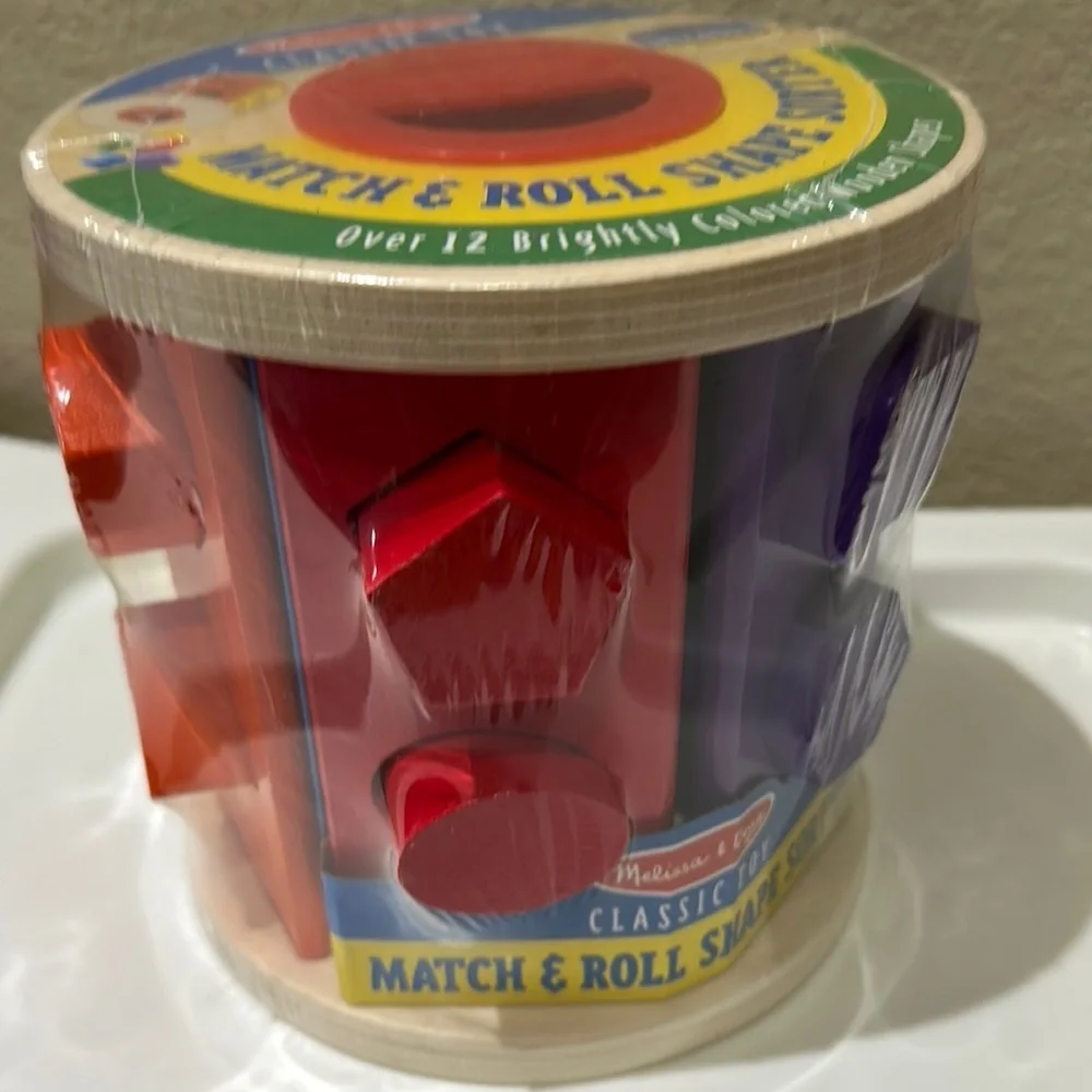 Melissa & Doug Red and Purple Learning Toys Match & Roll Shape Sort Set